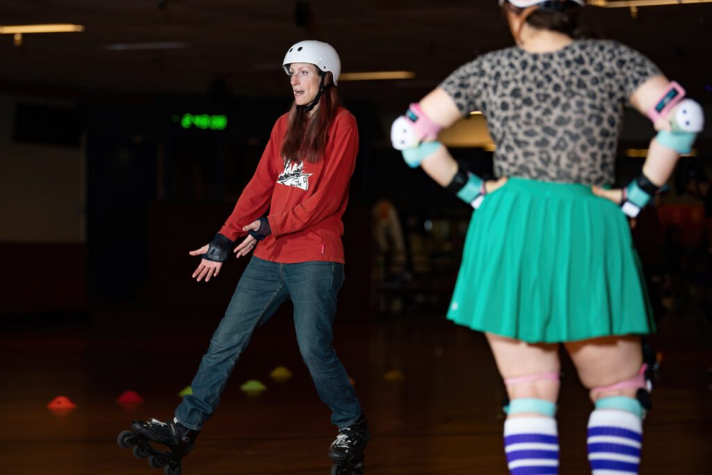 Woman in red and blue roller skates.