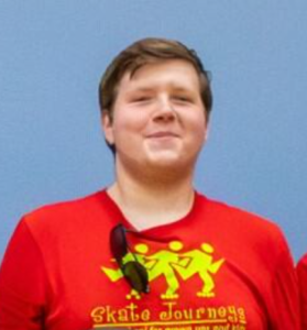 Man wearing red shirt with logo.