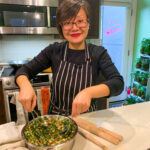 Woman preparing filling for dumplings.