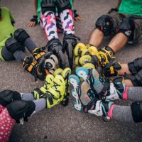 Kids wearing roller skates and pads